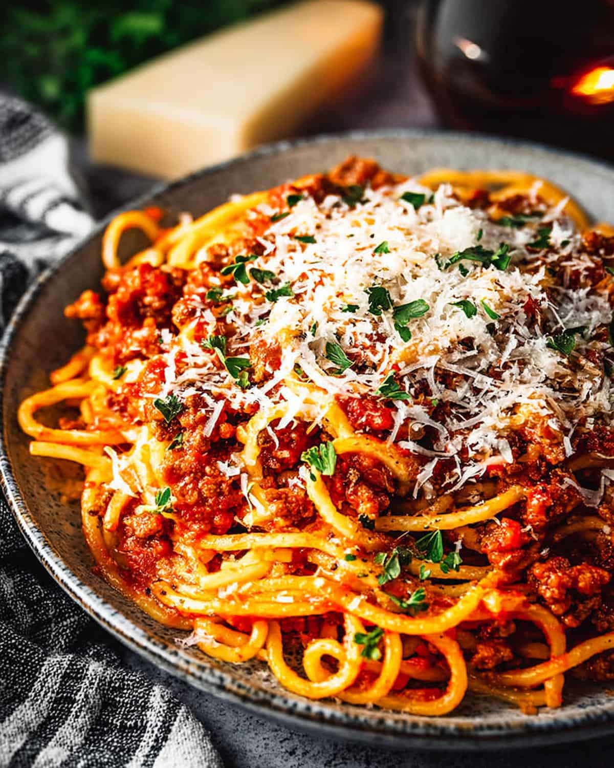 Instant Pot spaghetti with rich meat sauce, topped with freshly grated Parmesan cheese and parsley.