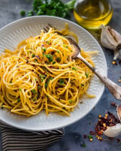 Instant Pot spaghetti aglio e olio with garlic, olive oil, parsley, and red pepper flakes.