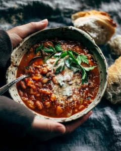 Chunky instant pot minestrone with hearty beans, tender vegetables, rich tomato broth, and a sprinkle of parmesan.