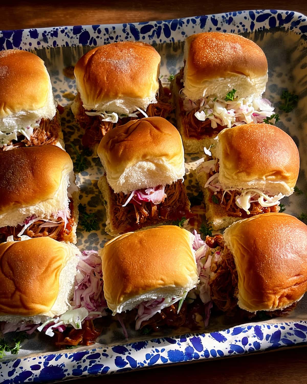 Instant Pot BBQ Shredded Chicken Sliders with tender shredded chicken, tangy BBQ sauce, and crunchy coleslaw.